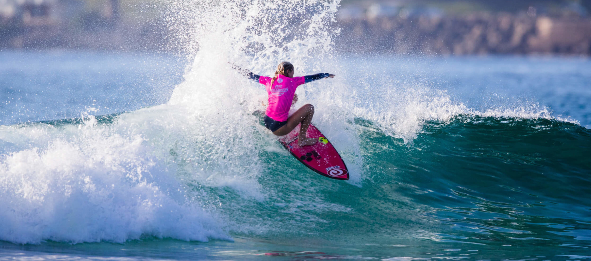 Female surfing at the World Juniors Competition