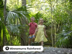 Young biy and girl walking through Minnamurra rainforest