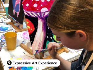 Child painting at Expressive Art Experience