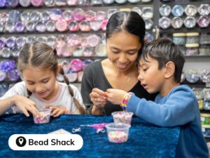 Bead Shack - mother and children making bead bracelets - School Holiday Activities - Kiama