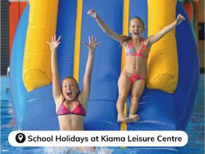 Children on blow up slide at Kiama leisure Centre - School Holiday Water Activities